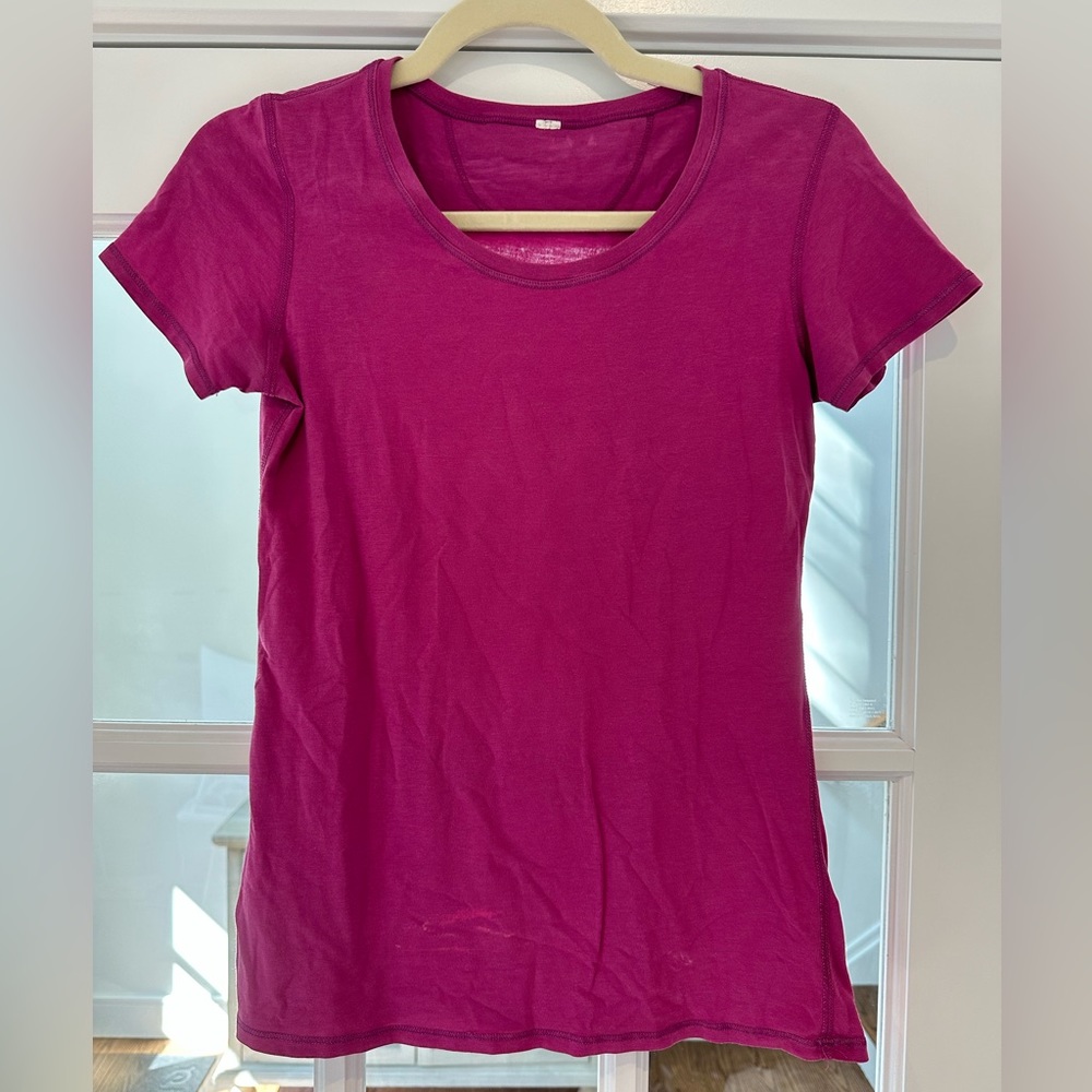 Lululemon purple tee size 4/xs. Slight discoloration